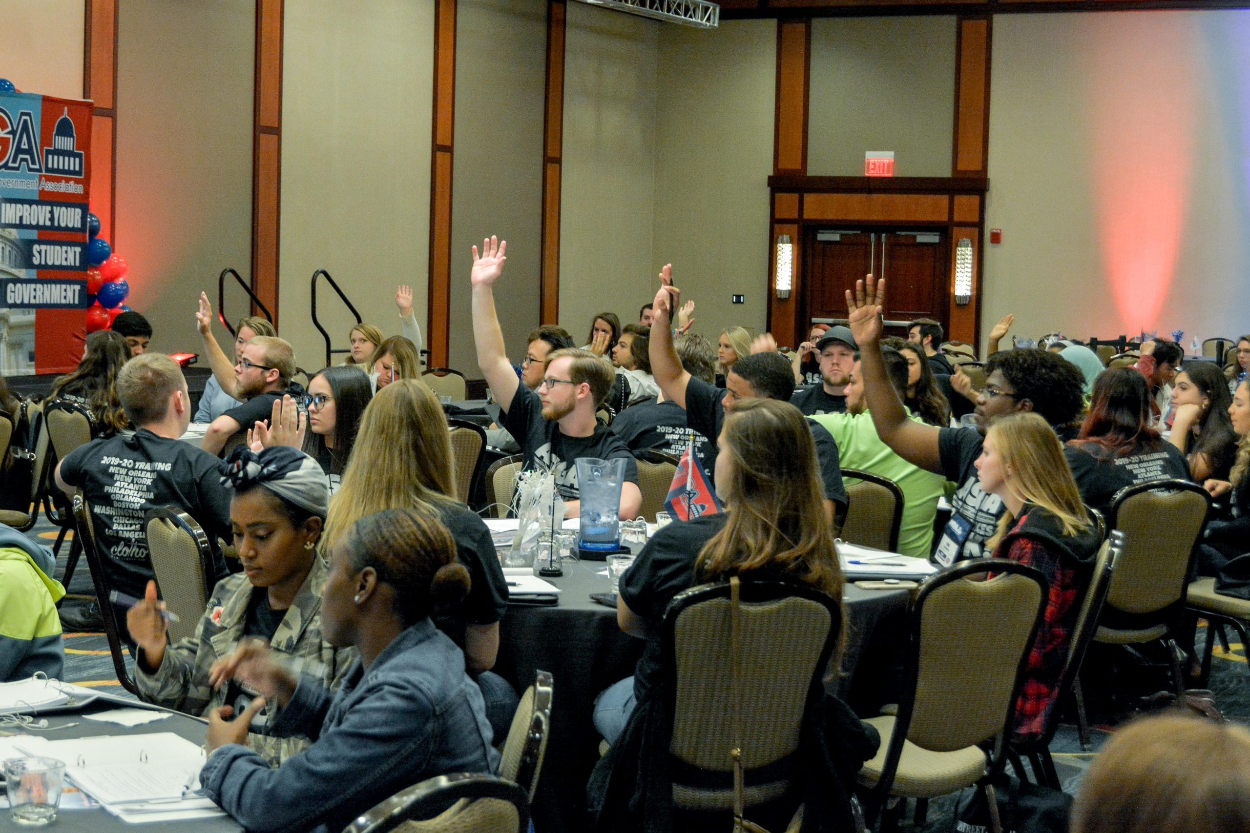 Student Government leaders raising hands at ASGA